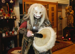 Taoist master wearing the mask of the Celestial fox for the Taoist ceremony of warding off evil spirits